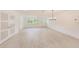 Spacious living room featuring updated floors and plenty of natural light at 316 Barbara Cir, Belleair, FL 33756