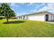 Spacious backyard with a lush green lawn at 3401 Stonehaven E Ct # A, Palm Harbor, FL 34684