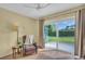 Bedroom with a sliding glass door to the yard at 3401 Stonehaven E Ct # A, Palm Harbor, FL 34684