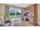 Den with a vintage desk and a view to the back yard at 3401 Stonehaven E Ct # A, Palm Harbor, FL 34684