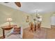 Inviting dining room with a glass top table, chandelier lighting, and an area rug that adds warmth at 3401 Stonehaven E Ct # A, Palm Harbor, FL 34684