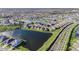 Scenic aerial view of a residential community with multiple homes and tranquil lakes, highlighting the neighborhood's layout at 34303 Radley Way, Wesley Chapel, FL 33545