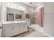 Bathroom featuring a double sink vanity and a shower and tub with tile backsplash at 34303 Radley Way, Wesley Chapel, FL 33545