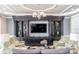 Cozy living room with custom built-ins, decorative lighting, and comfortable seating arrangements at 34303 Radley Way, Wesley Chapel, FL 33545