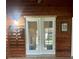 Spacious living area features a wood accent wall and glass doors leading to the backyard at 35118 Whispering Oaks Blvd, Dade City, FL 33523