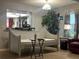 Inviting living area featuring a cozy daybed, decorative lighting, and a comfortable chair at 35118 Whispering Oaks Blvd, Dade City, FL 33523