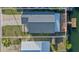 Aerial view of the home showcasing the spacious lot, waterfront location, and backyard deck at 3515 Centavo Ct, Hernando Beach, FL 34607