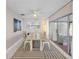 Inviting dining room with modern furnishings, complemented by natural light and a view of the outdoor space at 3515 Centavo Ct, Hernando Beach, FL 34607