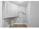 Laundry room features a white door and curtained area for laundry equipment at 3515 Centavo Ct, Hernando Beach, FL 34607