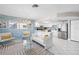 Bright and airy living space featuring modern decor, stainless steel appliances, and a kitchen island for entertaining at 3515 Centavo Ct, Hernando Beach, FL 34607