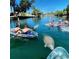 Scenic view of people kayaking with manatees in clear blue water, highlighting the local wildlife at 3515 Centavo Ct, Hernando Beach, FL 34607