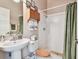 Neat bathroom with a neutral color scheme, shower, sink, and medicine cabinet at 3819 Brooksworth Ave, Tarpon Springs, FL 34688