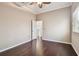 This bedroom boasts wood-look floors, neutral walls, and an open doorway, offering simplicity and style at 3819 Brooksworth Ave, Tarpon Springs, FL 34688