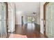 Open foyer showcasing hardwood floors, neutral walls, and sliding glass doors to the pool at 3819 Brooksworth Ave, Tarpon Springs, FL 34688