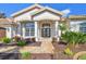 Inviting front entrance with double doors, stone walkway, and lush landscaping at 3819 Brooksworth Ave, Tarpon Springs, FL 34688