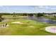 Scenic aerial view of the golf course with sand traps and small pond at 3819 Brooksworth Ave, Tarpon Springs, FL 34688