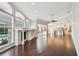 Expansive open-concept living room flowing into the kitchen and showcasing hardwood floors and natural light at 3819 Brooksworth Ave, Tarpon Springs, FL 34688