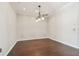 Formal living room with hardwood floors and a chandelier lighting fixture at 3819 Brooksworth Ave, Tarpon Springs, FL 34688
