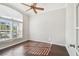 Bright office space with hardwood floors, a ceiling fan, and plantation shutters on the window at 3819 Brooksworth Ave, Tarpon Springs, FL 34688
