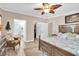 Light and airy bedroom with a king bed, ensuite bath, and a walk-in closet with ample space at 410 Georgia Ave, Crystal Beach, FL 34681
