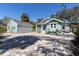 Charming home with a matching detached garage and stamped concrete driveway at 410 Georgia Ave, Crystal Beach, FL 34681