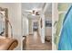 Hallway with wood floors, bright walls, and decorative wall art at 410 Georgia Ave, Crystal Beach, FL 34681