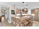 Stylish kitchen featuring stainless steel appliances, granite countertops, and custom cabinetry at 410 Georgia Ave, Crystal Beach, FL 34681