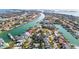 Stunning aerial view of waterfront homes, a canal, and boat docks in a beautiful residential community at 436 3Rd N Ave, Tierra Verde, FL 33715