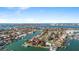 Overhead view of waterfront homes, canals and boats on a sunny day in a coastal neighborhood at 436 3Rd N Ave, Tierra Verde, FL 33715