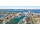 Aerial view of community waterways showcasing boats, marinas, and city views along the waterfront homes at 436 3Rd N Ave, Tierra Verde, FL 33715