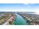Stunning aerial view showcasing waterfront condos, canals and boats on a sunny day in a coastal neighborhood at 436 3Rd N Ave, Tierra Verde, FL 33715