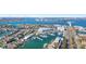 Scenic aerial view of marina and channel lined with boats, homes, and a beautiful coastal community at 436 3Rd N Ave, Tierra Verde, FL 33715