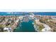 Overhead view of marina and channel lined with boats, homes, and a beautiful coastal community at 436 3Rd N Ave, Tierra Verde, FL 33715