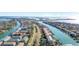 Stunning aerial view showcasing waterfront condos, canals and boats on a sunny day in a coastal neighborhood at 436 3Rd N Ave, Tierra Verde, FL 33715