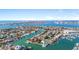 Gorgeous aerial view of waterfront homes, canals and boats on a sunny day in a coastal neighborhood at 436 3Rd N Ave, Tierra Verde, FL 33715
