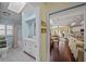Sunlit bathroom featuring a white vanity, toilet, shower/tub, and a view into the living area at 436 3Rd N Ave, Tierra Verde, FL 33715