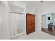 Elegant bathroom features a large shower, vintage wardrobe, and a doorway leading to another room at 436 3Rd N Ave, Tierra Verde, FL 33715