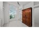 Bathroom with large window, shower, and wardrobe at 436 3Rd N Ave, Tierra Verde, FL 33715