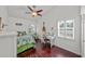 Bright bedroom with high ceilings, a ceiling fan, multiple windows, and a comfortable desk area at 436 3Rd N Ave, Tierra Verde, FL 33715