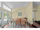 Bright dining room features natural light, hardwood floors, and sliding glass doors at 436 3Rd N Ave, Tierra Verde, FL 33715
