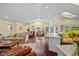 Spacious living room with a kitchen, comfortable seating, and ample natural light at 436 3Rd N Ave, Tierra Verde, FL 33715