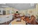 Spacious living room featuring hardwood floors, vaulted ceilings, comfortable seating, and stylish decor at 436 3Rd N Ave, Tierra Verde, FL 33715