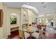 Cozy living room with large windows and hardwood floors with a view of the patio at 436 3Rd N Ave, Tierra Verde, FL 33715