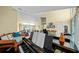 Bright living room boasts hardwood floors, comfortable seating, and natural light throughout the space at 436 3Rd N Ave, Tierra Verde, FL 33715