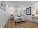 Inviting bedroom with hardwood floors, neutral decor, and ample natural light at 4944 28Th S Ave, Gulfport, FL 33707