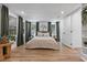 Bright bedroom with wood flooring, neutral walls, and multiple windows at 4944 28Th S Ave, Gulfport, FL 33707