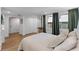 Well-lit bedroom featuring wood floors, closet space, and neutral walls at 4944 28Th S Ave, Gulfport, FL 33707