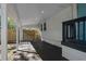 White carport next to the entrance has a black floor and a view of a newly built wooden fence at 4944 28Th S Ave, Gulfport, FL 33707
