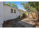 Exterior of the home featuring a fenced-in yard and lush green landscaping at 4944 28Th S Ave, Gulfport, FL 33707