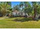 Charming one-story home with a manicured lawn, light blue door, and inviting front porch at 4944 28Th S Ave, Gulfport, FL 33707